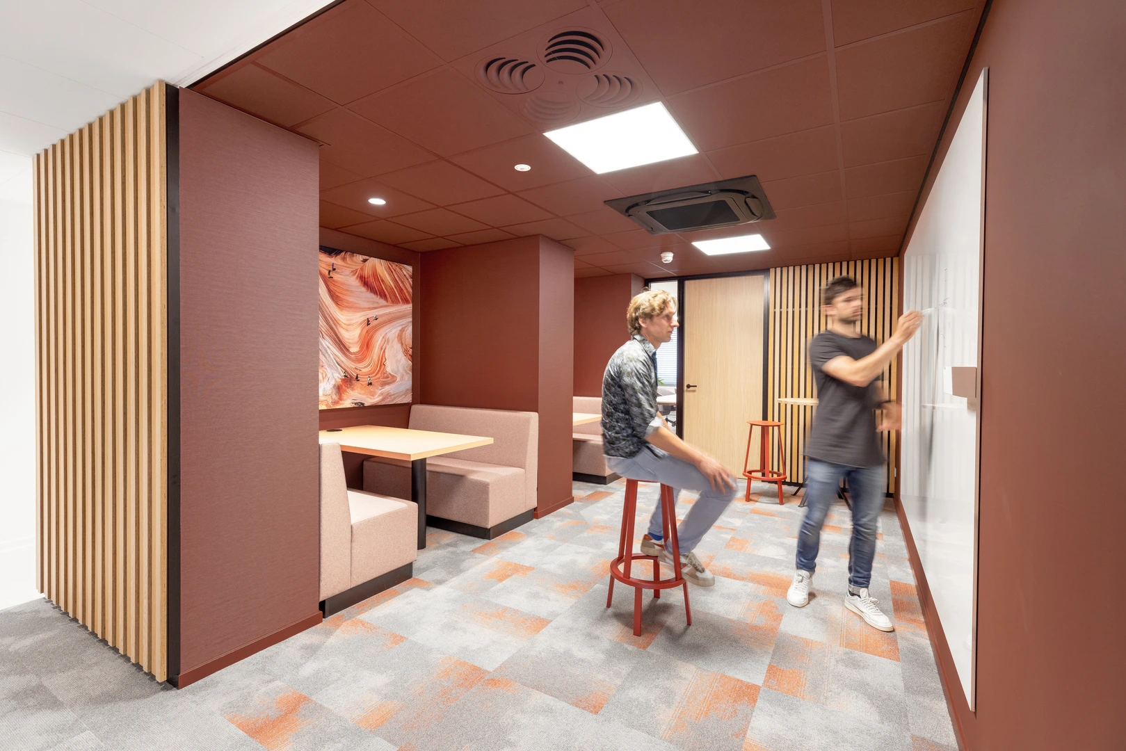 Color-all acoustic ceiling tiles in Scarlet add understated luxury to various areas